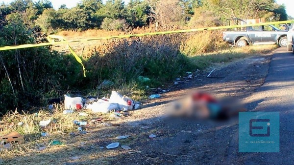 Abandonan cadáver torturado y encobijado en la Jacona - Los Reyes