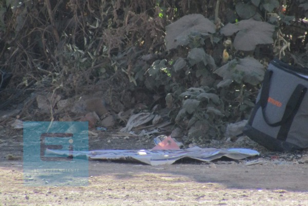 Abandonan hielera con una cabeza humana y una narcomanta, en Zamora